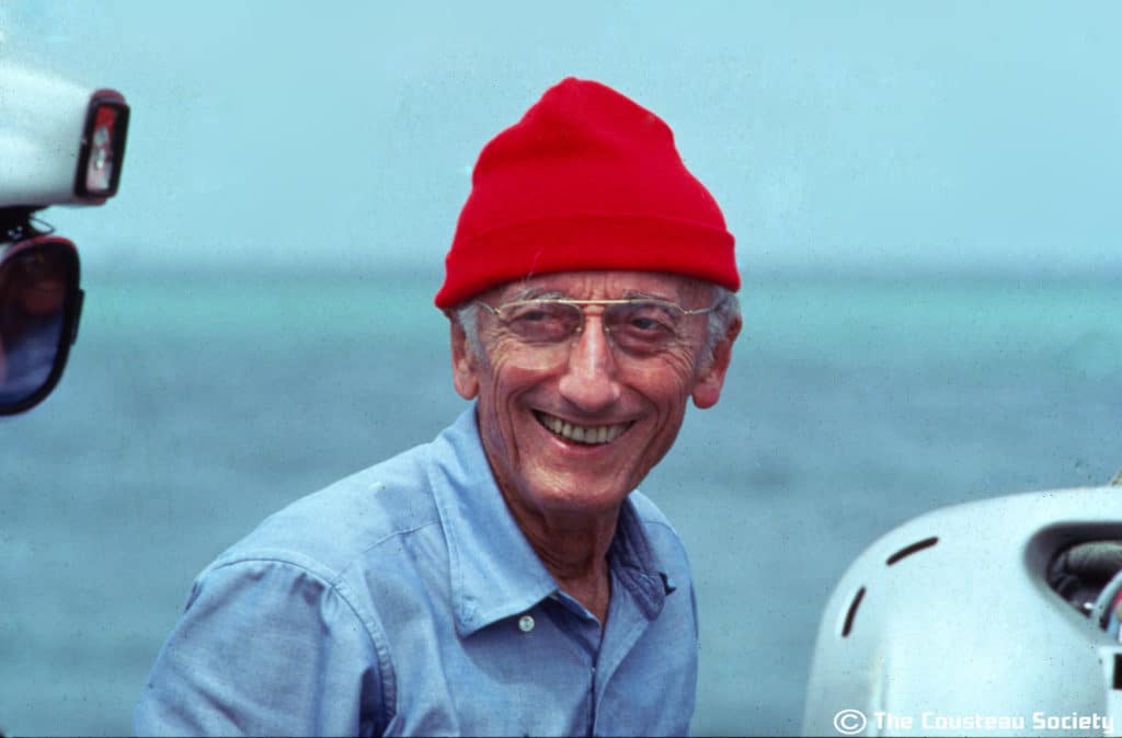 Jacques Cousteau wearing his iconic red hat, symbolizing ocean exploration and the legacy of The Cousteau Society, featured on the homepage.