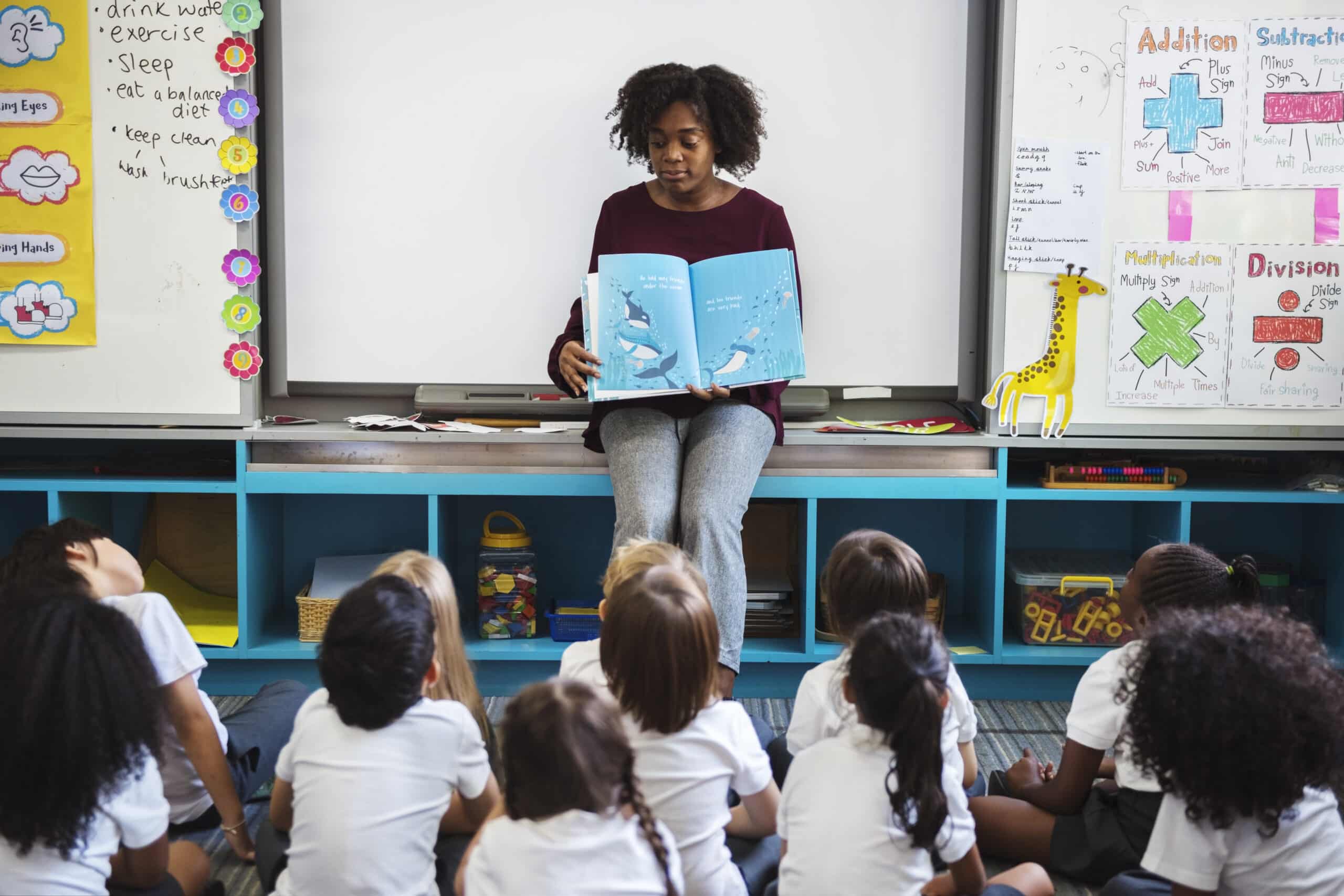 kindergarten students sitting on the floor listeni 2025 02 11 10 42 28 utc scaled
